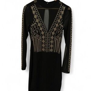 Venus black long-sleeve mini dress featuring an intricate gold embellishments